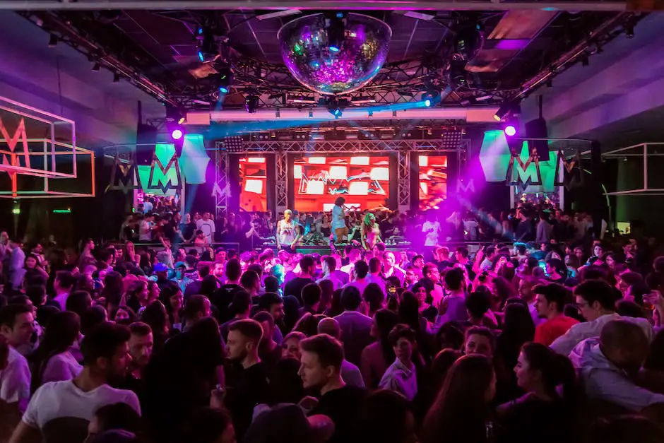 A Vibrant Nightlife Scene With Colorful Lights And People Dancing At A Nightclub