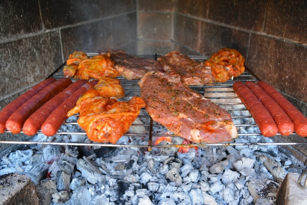 Smoking Various Meats Over Hot Coals