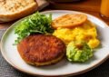 A Plate Of Food With Bread And Vegetables