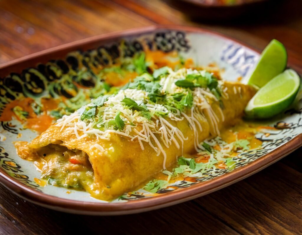 A Plate Of Food With Lime Wedges