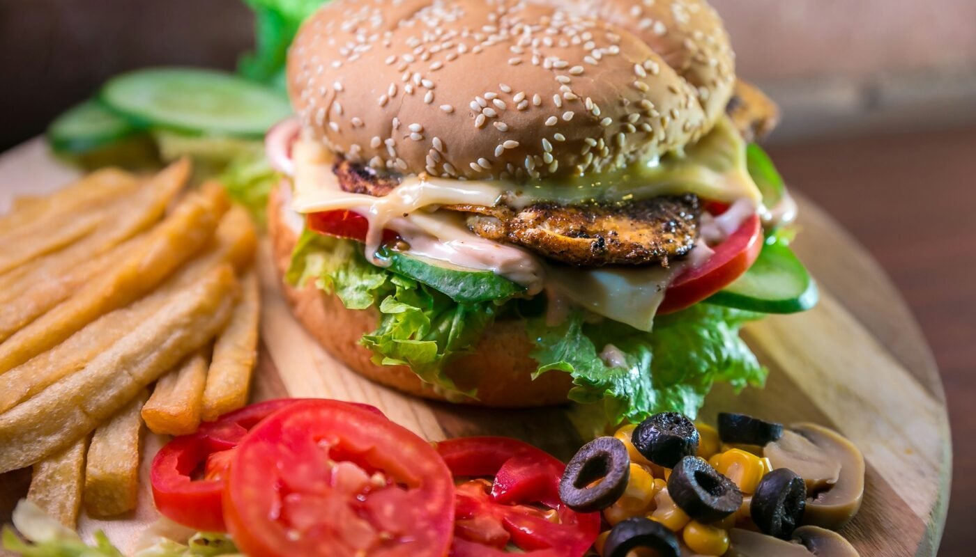 Delicious Burger With Fries And Vegetables