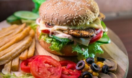 Delicious Burger With Fries And Vegetables